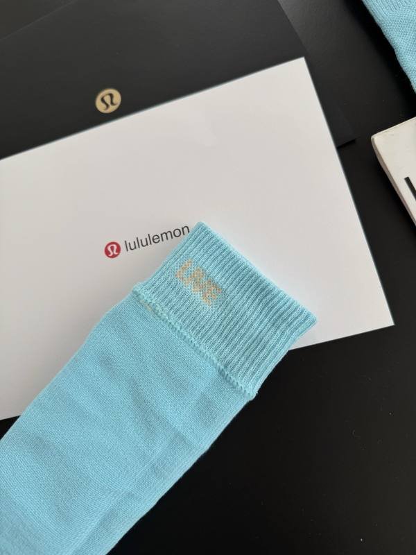 Lulu accessories The ribbed socks have jacquard knitting hidden inside and the front of the socks is embellished with classic logo embroidery The embroidery craftsmanship is clear and full